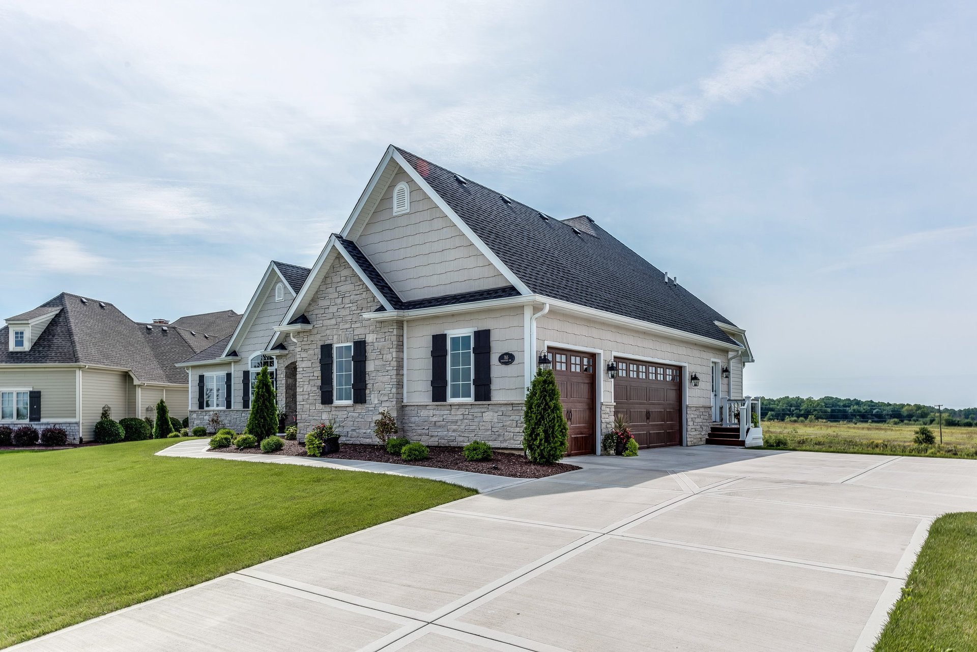 Three car garage with wide driveway